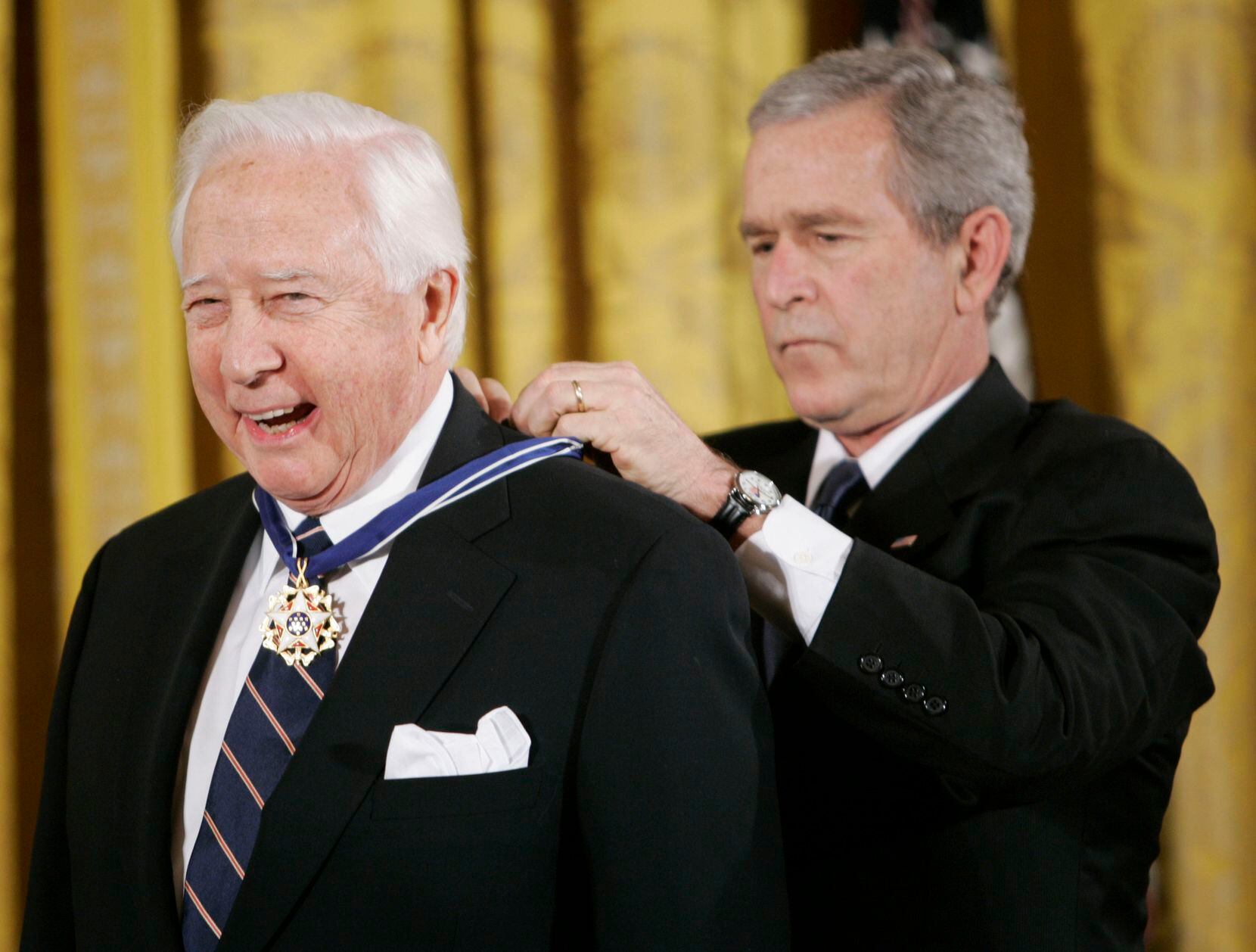 FILE - President George W. Bush, right, bestows the Presidential Medal of Freedom to author...