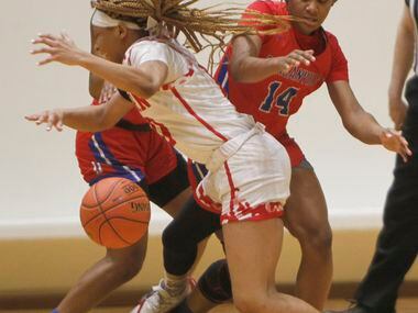Mesquite Horn guard Da'Lonna Choice (10) has the ball knocked loose by Duncanville guards...