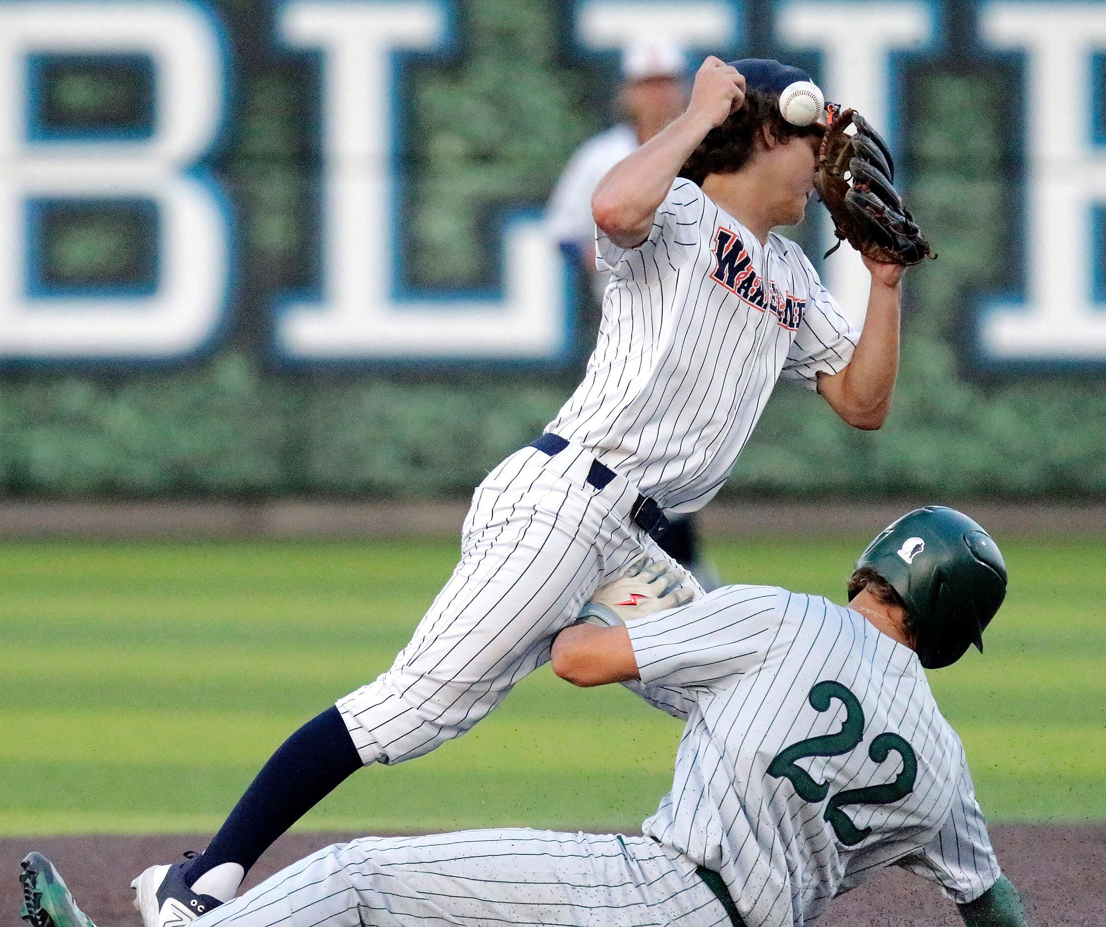 Reedy High School first baseman Kyle Olson (22) breaks up  a double play attempt by Wakeland...