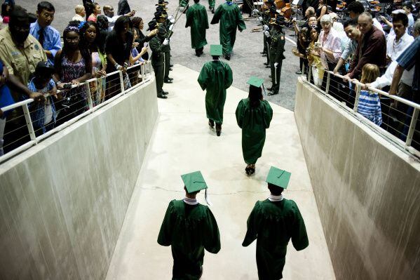 A file photo of graduates entering the Curtis Culwell Center for their graduation ceremony...