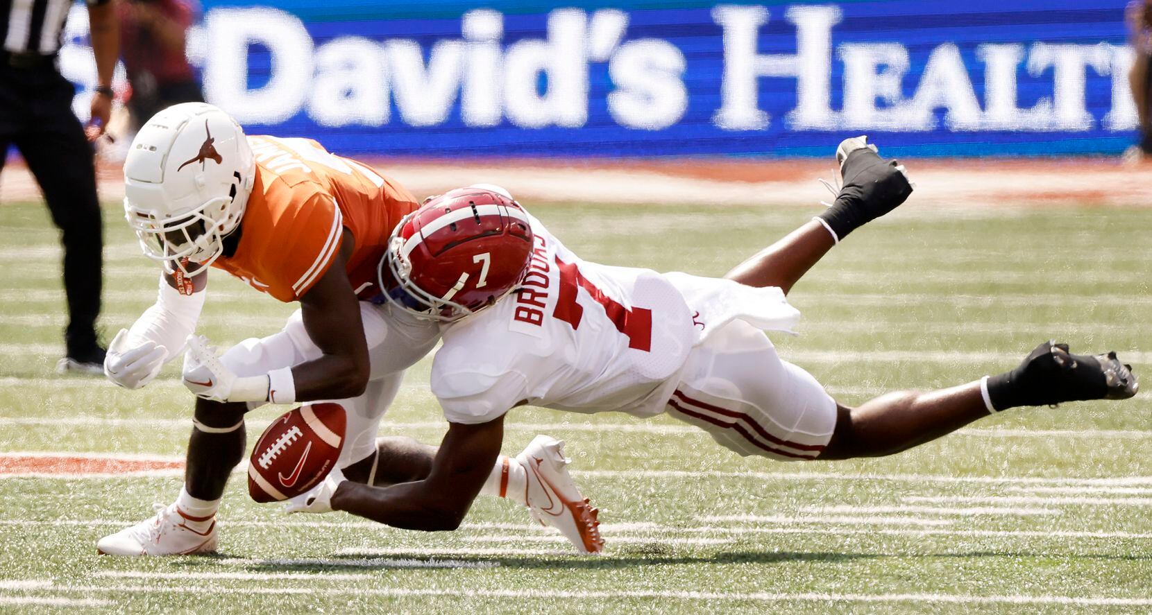 Texas Longhorns defensive back D'Shawn Jamison (5) nearly intercepts a pass intended for...