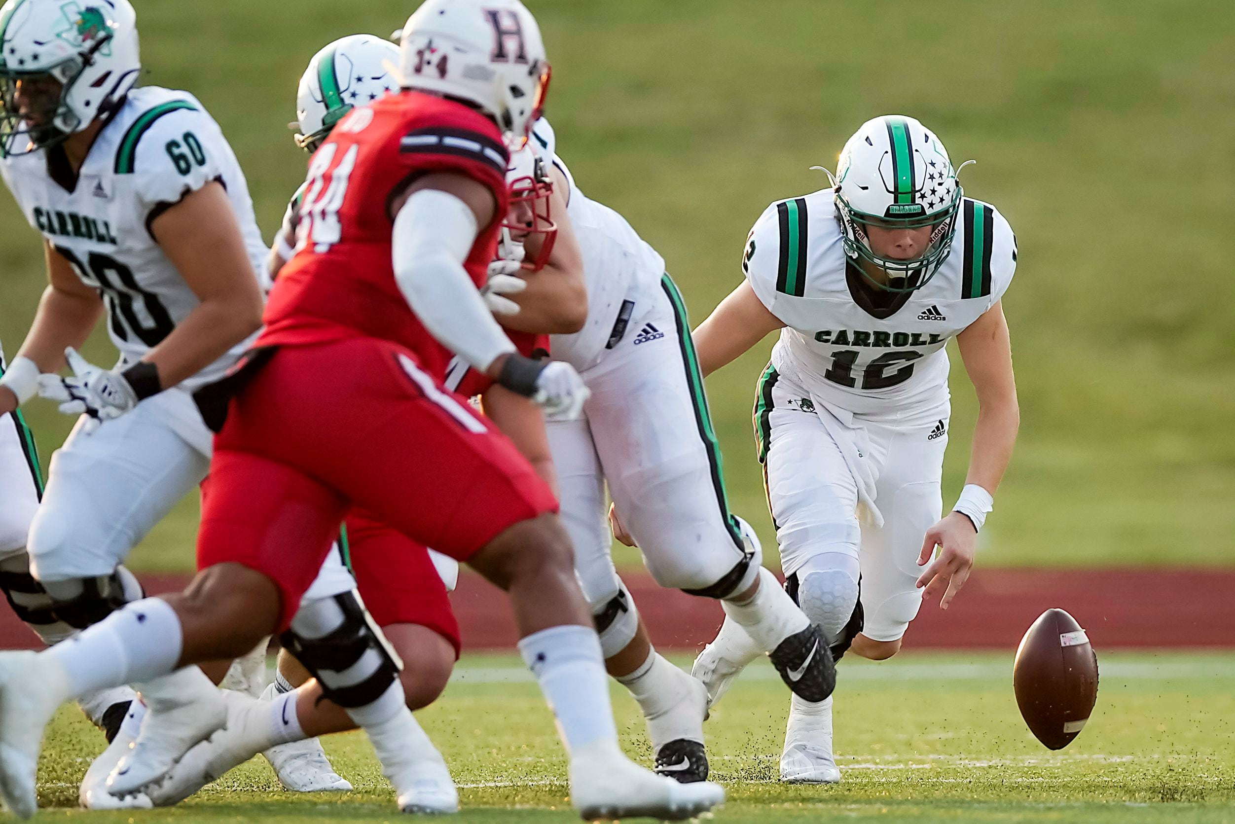 Southlake Carroll quarterback Kaden Anderson (12) chases a fumbled snap during the first...