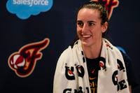 Indiana Fever guard Caitlin Clark speaks with the media after the WNBA basketball team...
