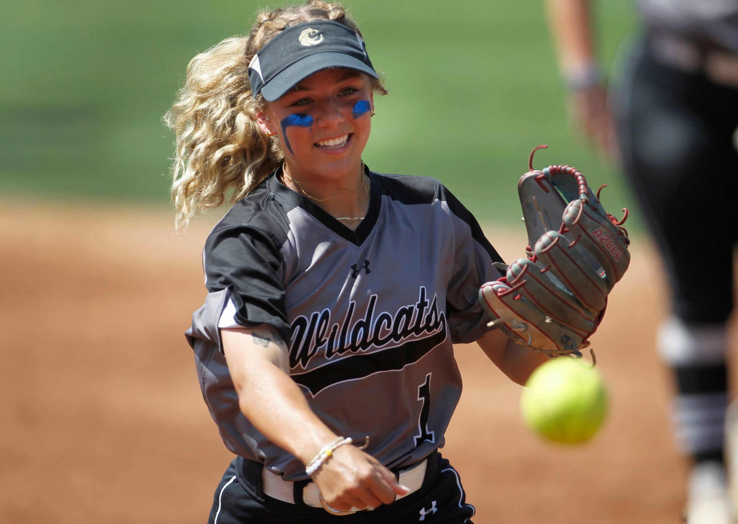 Denton Guyer 3rd baseman Avery Jefferson (1) warms up with teammates before the start of...