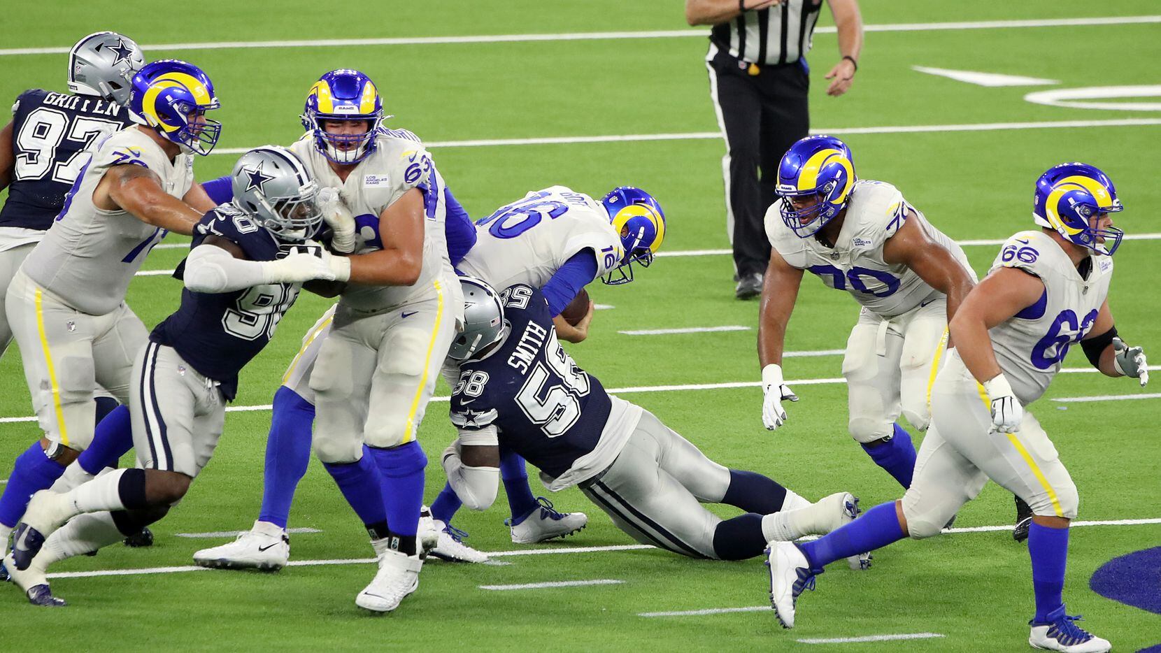 Aldon Smith #58 of the Dallas Cowboys sacks Jared Goff #16 of the Los Angeles Rams during...