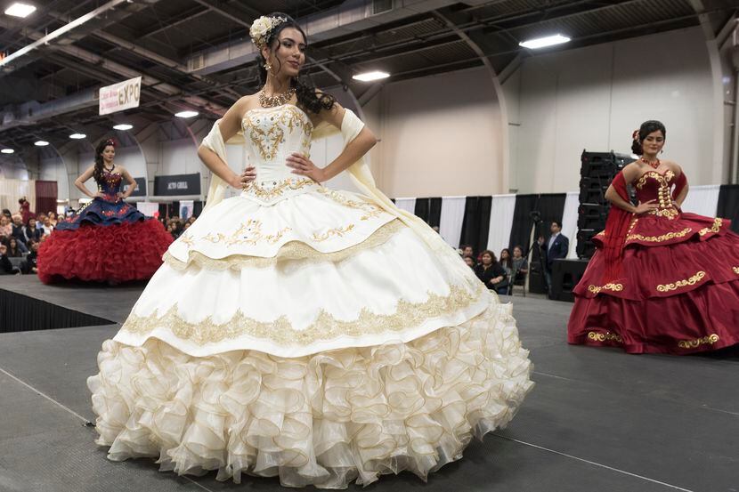 Quinceañera dresses are modeled during the Quince Girl Expo.