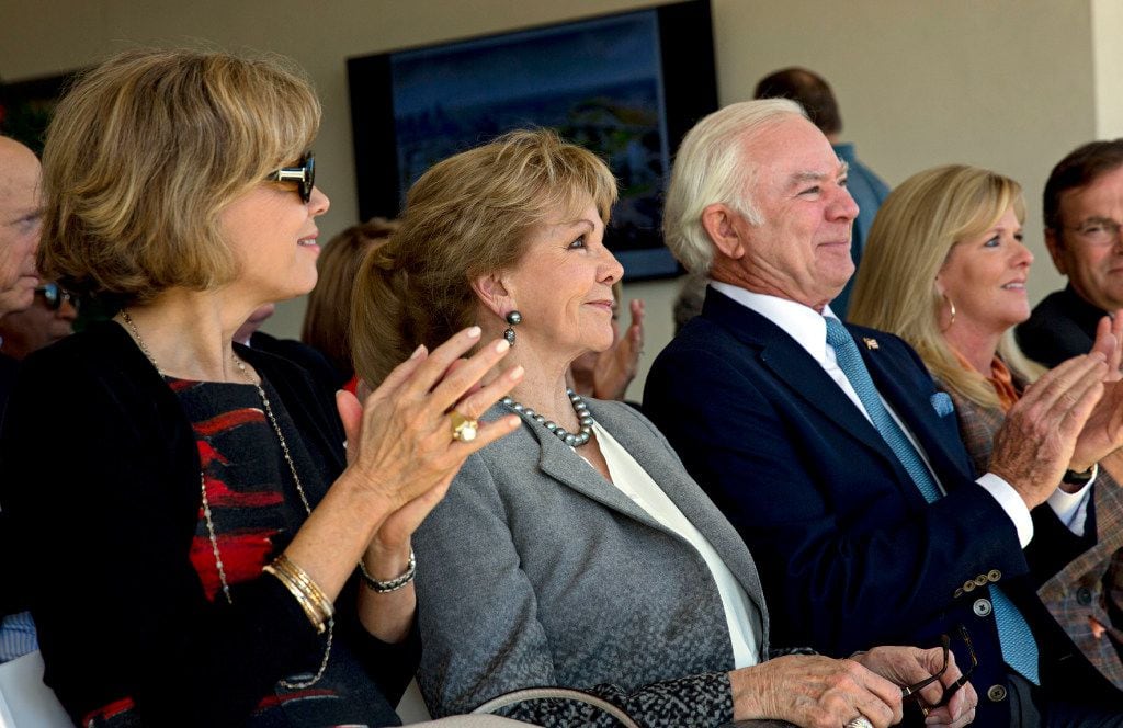 (From left) Lisa Simmons, Annette Simmons, Jerry Fronterhouse and Amy Simmons clap during a...