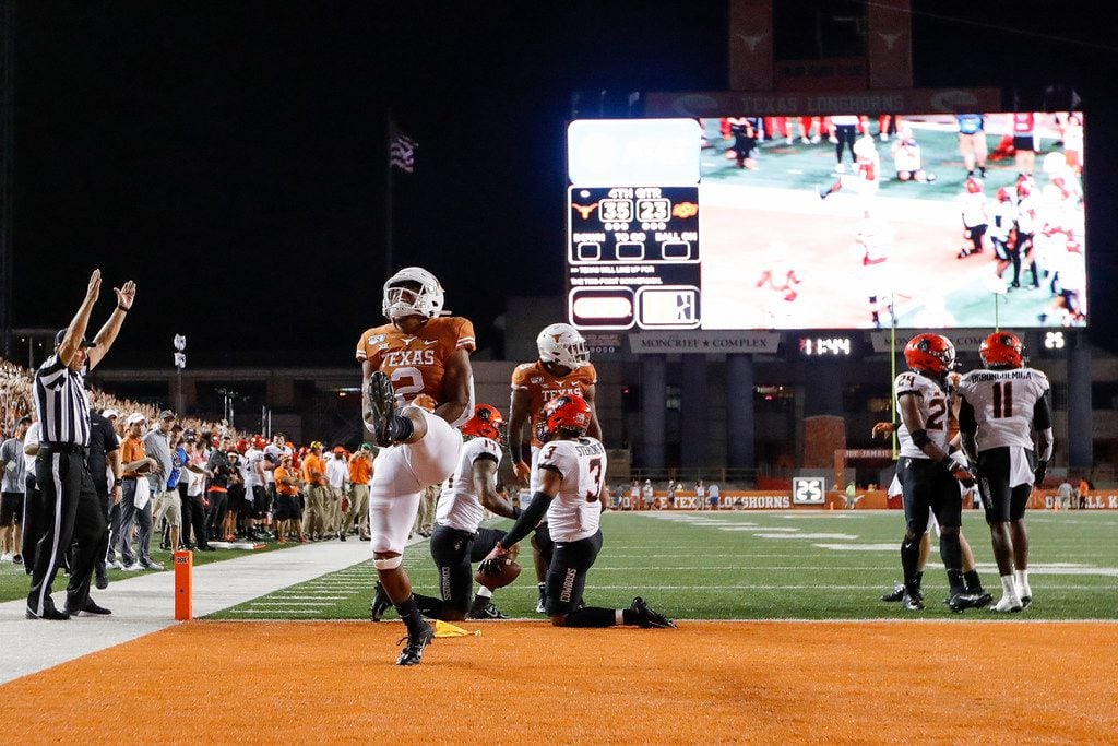 AUSTIN, TX - SEPTEMBER 21:  Roschon Johnson #2 of the Texas Longhorns celebrates after scoring a two point conversion in the fouth quarter against the Oklahoma State Cowboys at Darrell K Royal-Texas Memorial Stadium on September 21, 2019 in Austin, Texas.