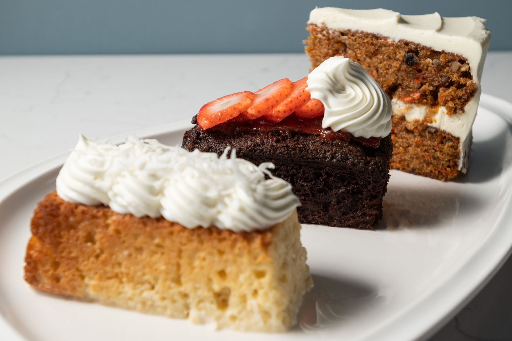 Lubellas offers tres leches cake (from left), chocolate cake with raspberry jam and carrot...