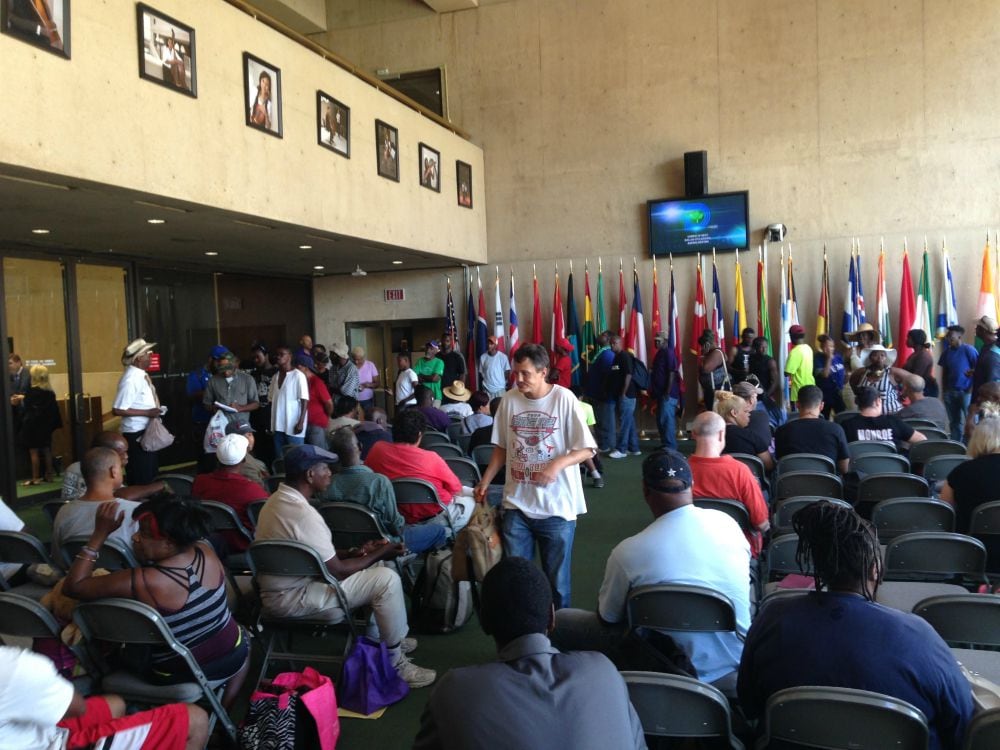 Homeless men and women gathered in the Flag Room outside of council chambers at Dallas City...