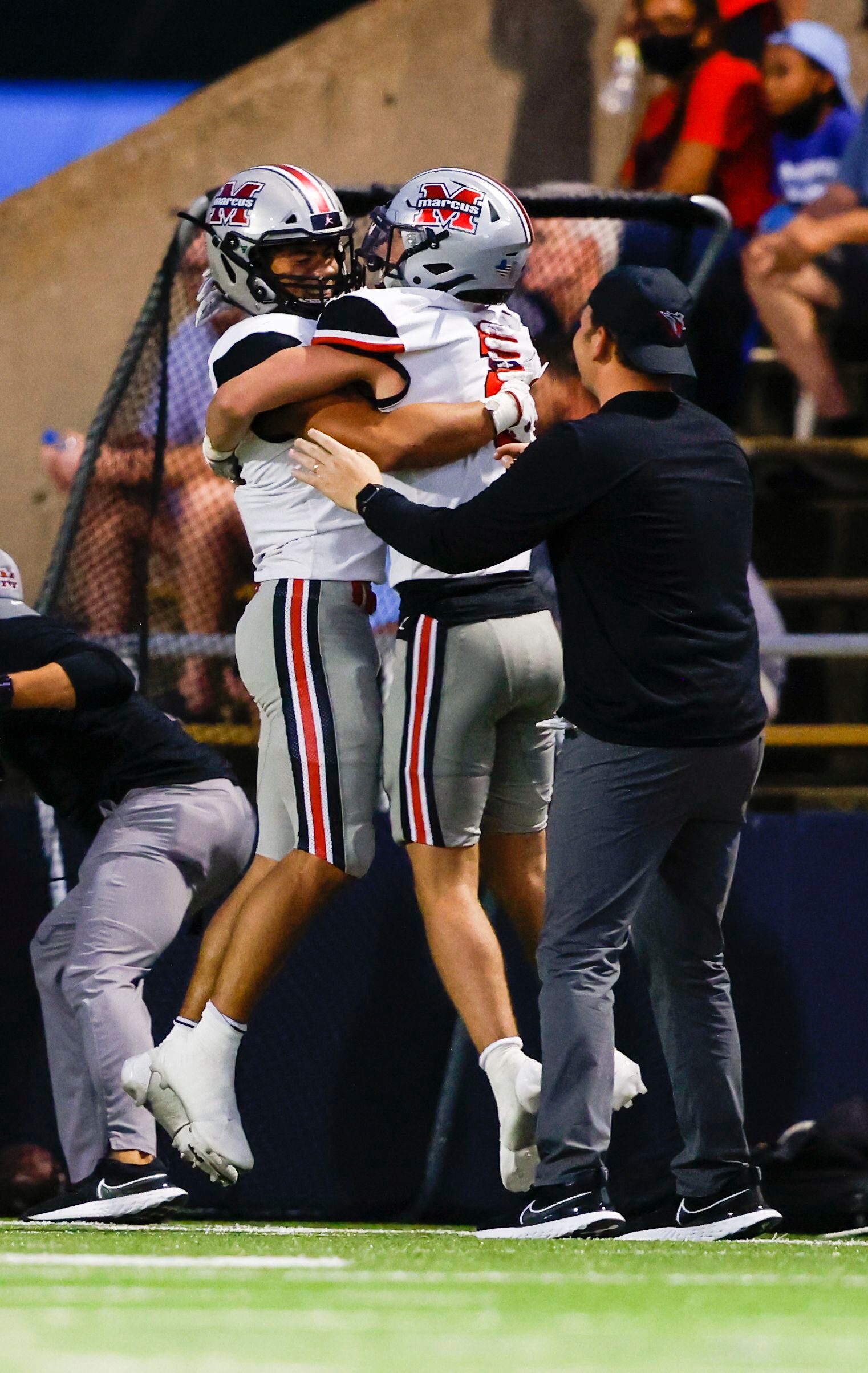 Flower Mound Marcus’s Chance Sautter (3) celebrates with his team after catching a touchdown...