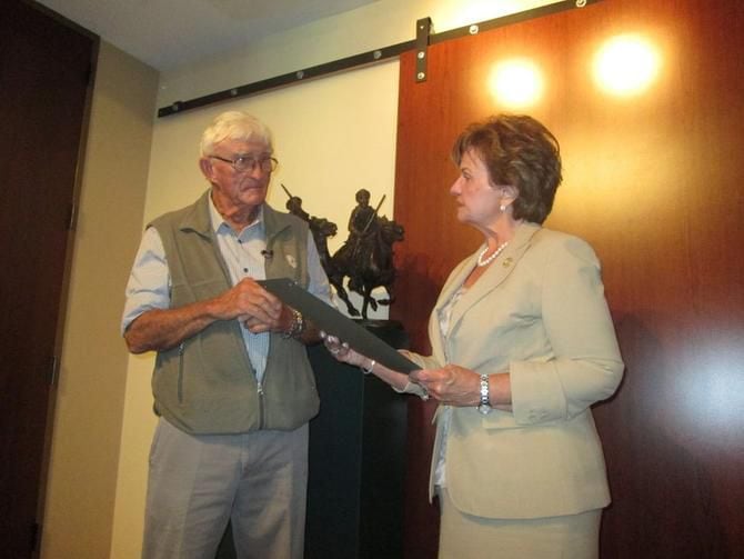 
Sculptor Robert Glen receives a proclamation from Rep. Linda Harper-Brown recognizing the...