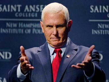 Former Vice President Mike Pence gestures during the "Politics and Eggs" breakfast...