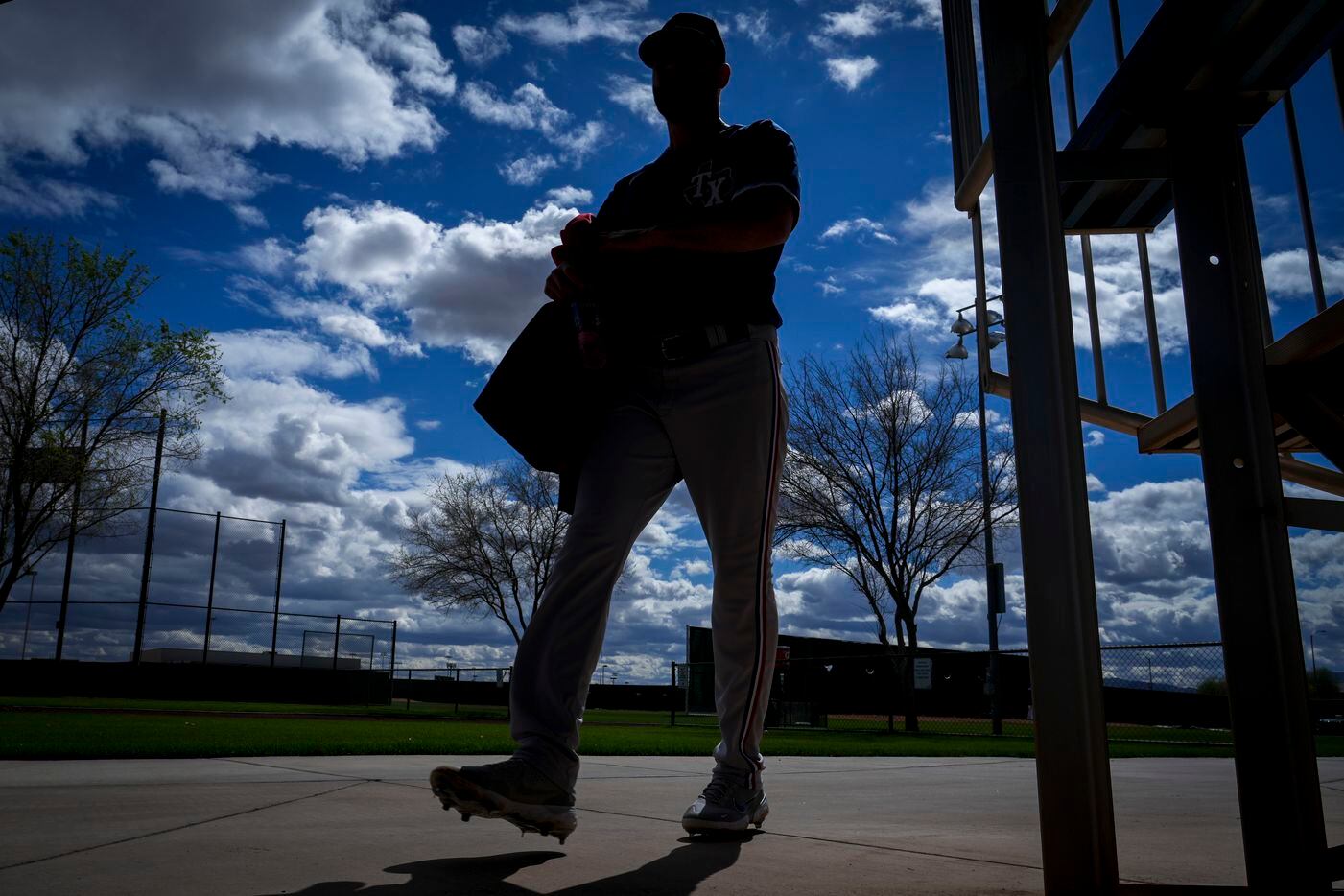 Texas Rangers pitcher Nick Tropeano walks between back fields before pitching in a “B” game...