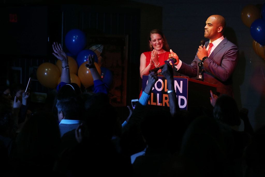 Colin Allred speaks to supporters with his wife Aly Eber during an election night party.