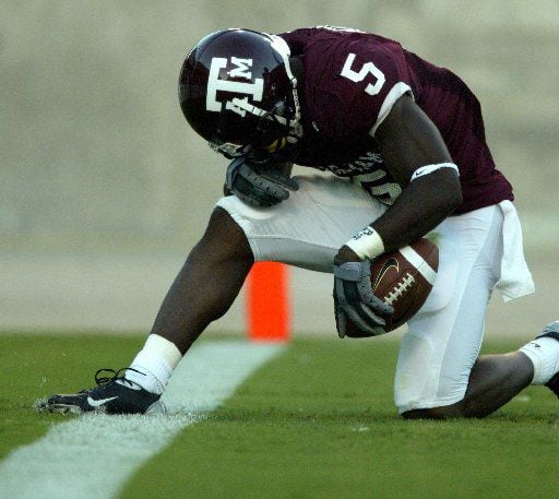 Terrence Murphy  kneels in the endzone after a80-yard touchdown run during first quarter action during Texas A&M's 28-26 victory over Utah at Kyle Field in College Station,  Saturday evening, September 6, 2003.