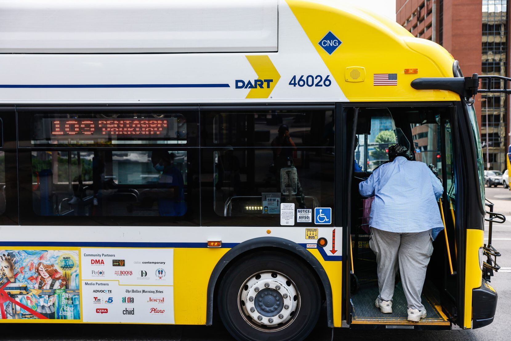 A person hops on the 109 bus at a bus stop on Pacific Ave in Dallas on Thursday, June 23....