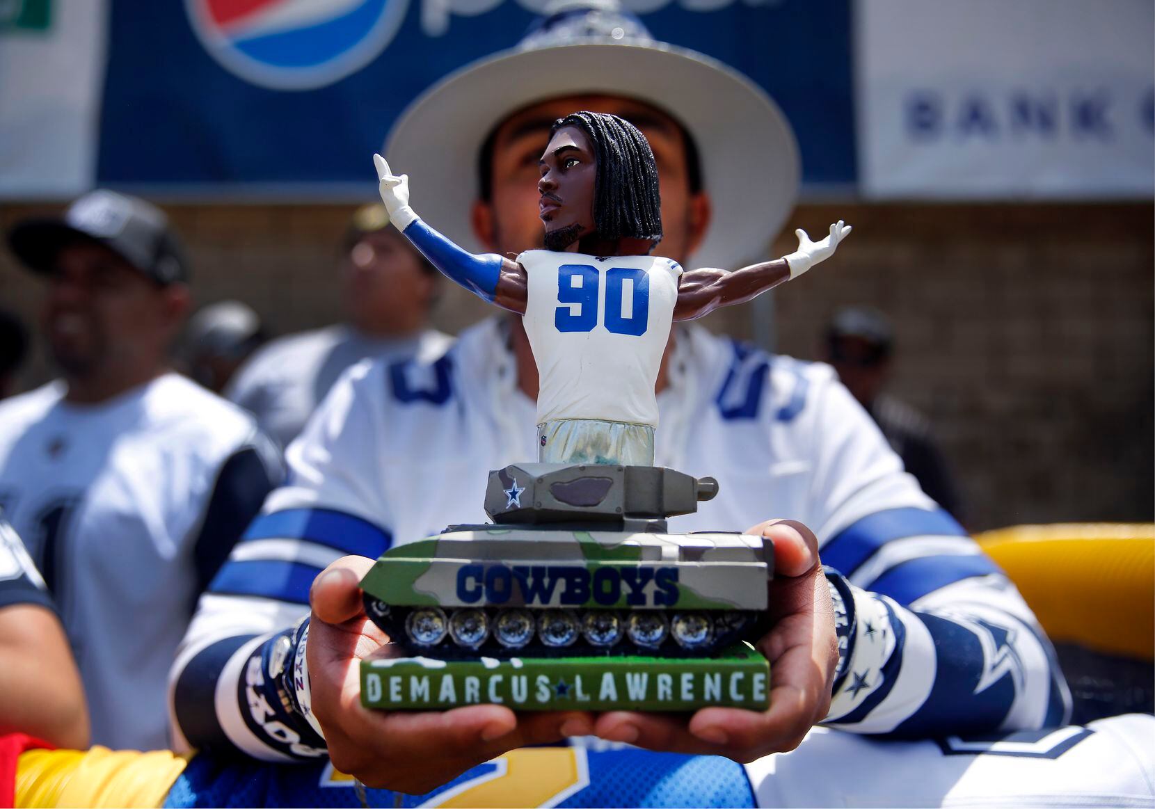 A Dallas Cowboys fan brought a tank sculpture of defensive end Demarcus Lawrence in hopes to...