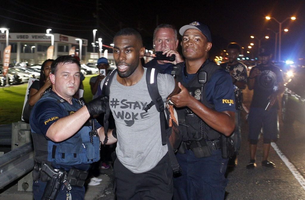 Police arrest activist DeRay Mckesson during a protest in Baton Rouge, La.