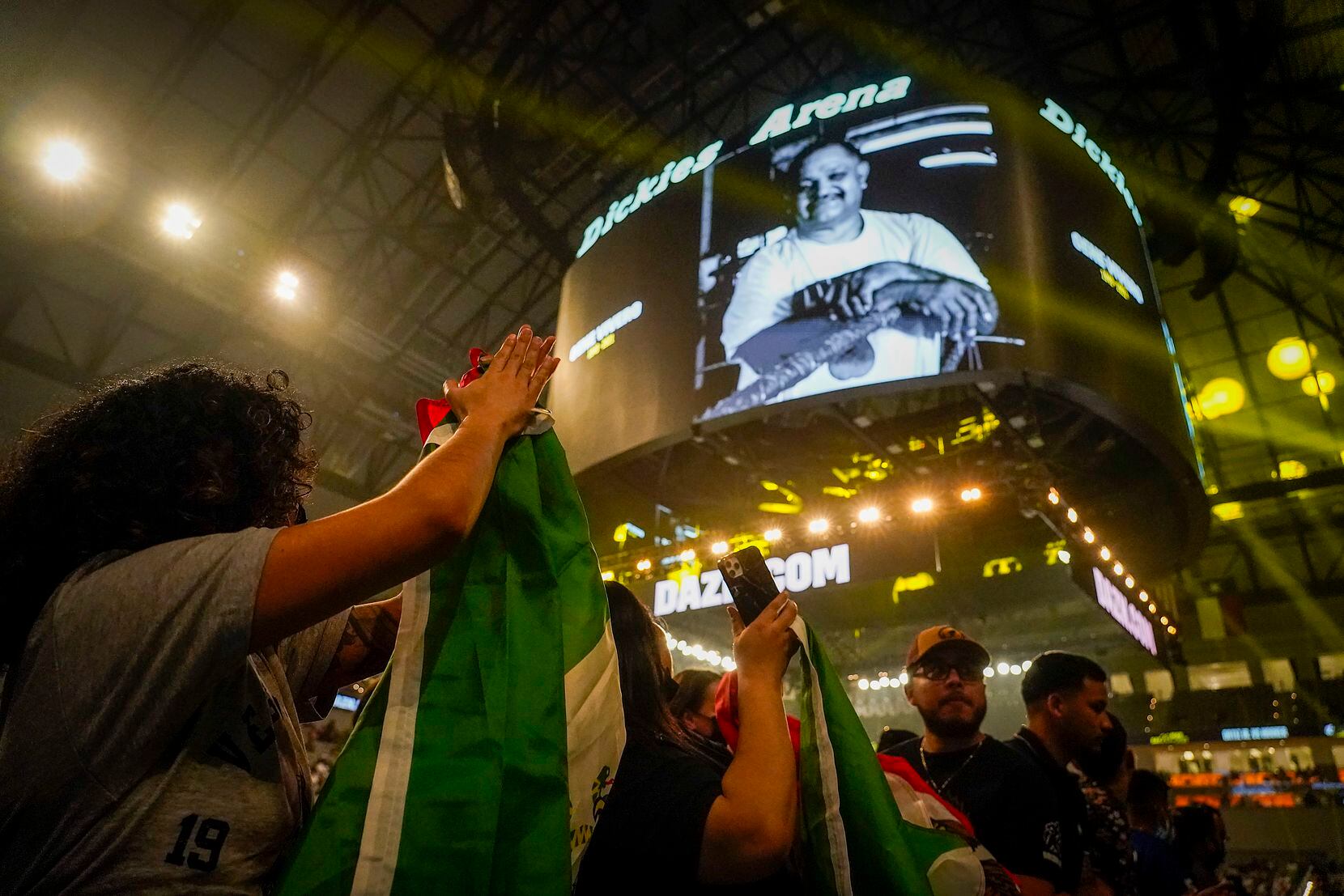 Fans applaud during a remembrance for boxing coach Gene Vivero before Vergil Ortiz Jr. fights Maurice Hooker for the vacant WBO international welterweight title at Dickies Arena on Saturday, March 20, 2021, in Fort Worth. Vivero, the owner of Vivero Boxing Gym in Oak Cliff, died in February at the age of 71.