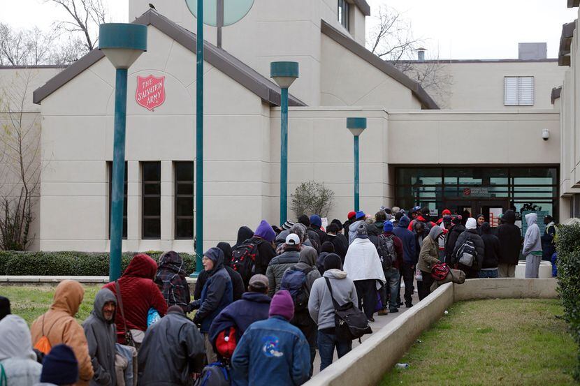 People waited in early February to check in for a bed at the Carr P. Collins Social Service...