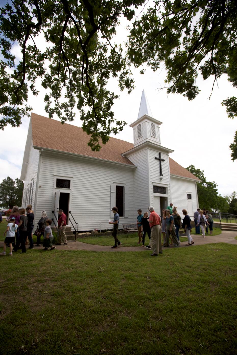 Churchgoers file out of College Mound United Methodist Church to enjoy the 2019 Decoration Day feast. Members of the community 40 miles east of Dallas have honored their ancestors with grave-site flowers and a feast in a tradition that dates back 134 years.
