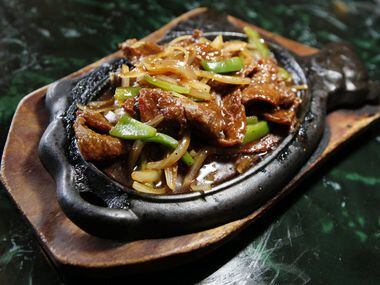 Sizzling platter beef tenderloin with bell peppers 