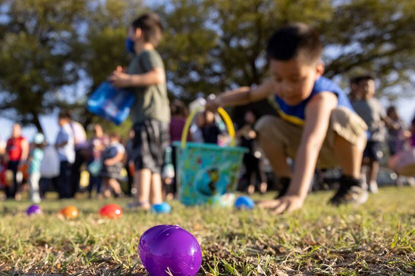 Kids look for eggs during a Dallas Park and Recreation Easter event.