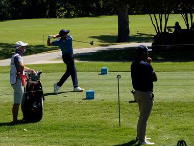 Before no fans around the 3rd tee box, PGA Tour golfer Sergio Garcia watches his drive...