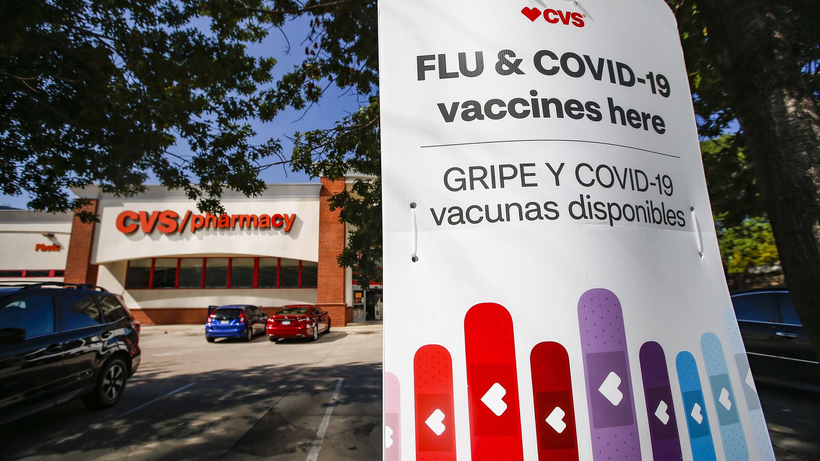 A CVS on Walnut Hill Lane in northeast Dallas advertises flu and COVID-19 vaccinations.