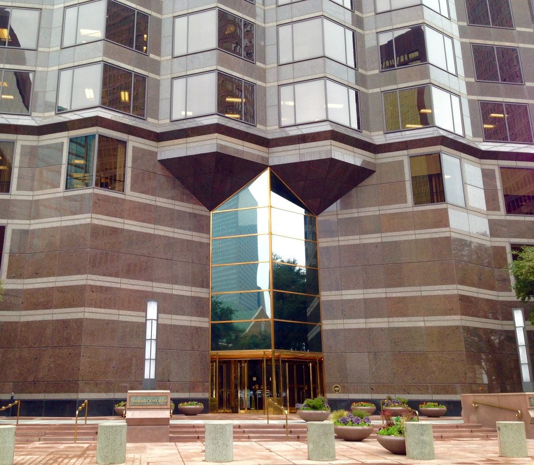 The current front of the Trammell Crow Center has a narrow entry and granite walls.