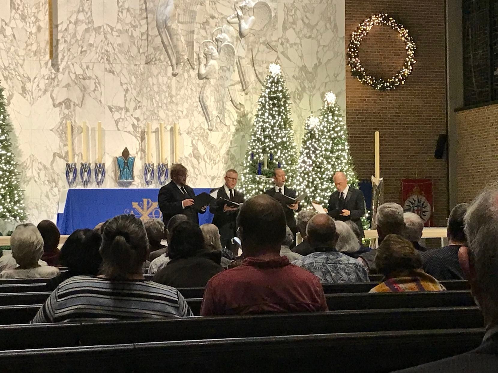 New York Polyphony performs a Christmas concert at Saint Michael and All Angels Church in...