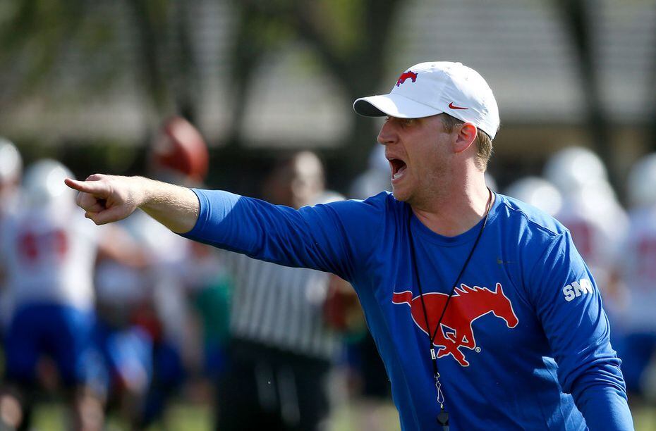 SMU New offensive coordinator Rhett Lashlee yells during the first spring practice of the season on the campus in Dallas, Wednesday, March 21, 2018.