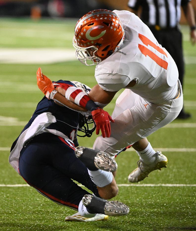 Celina's Gabe Gayton (11) tries to spin away from a tackle attempt by Aubrey's Kai Bagley (2) in the first half of a Class 4A Division II Region I final high school playoff football game between Aubrey and Celina, Friday, Dec. 3, 2021, in Denton, Texas. (Matt Strasen/Special Contributor)