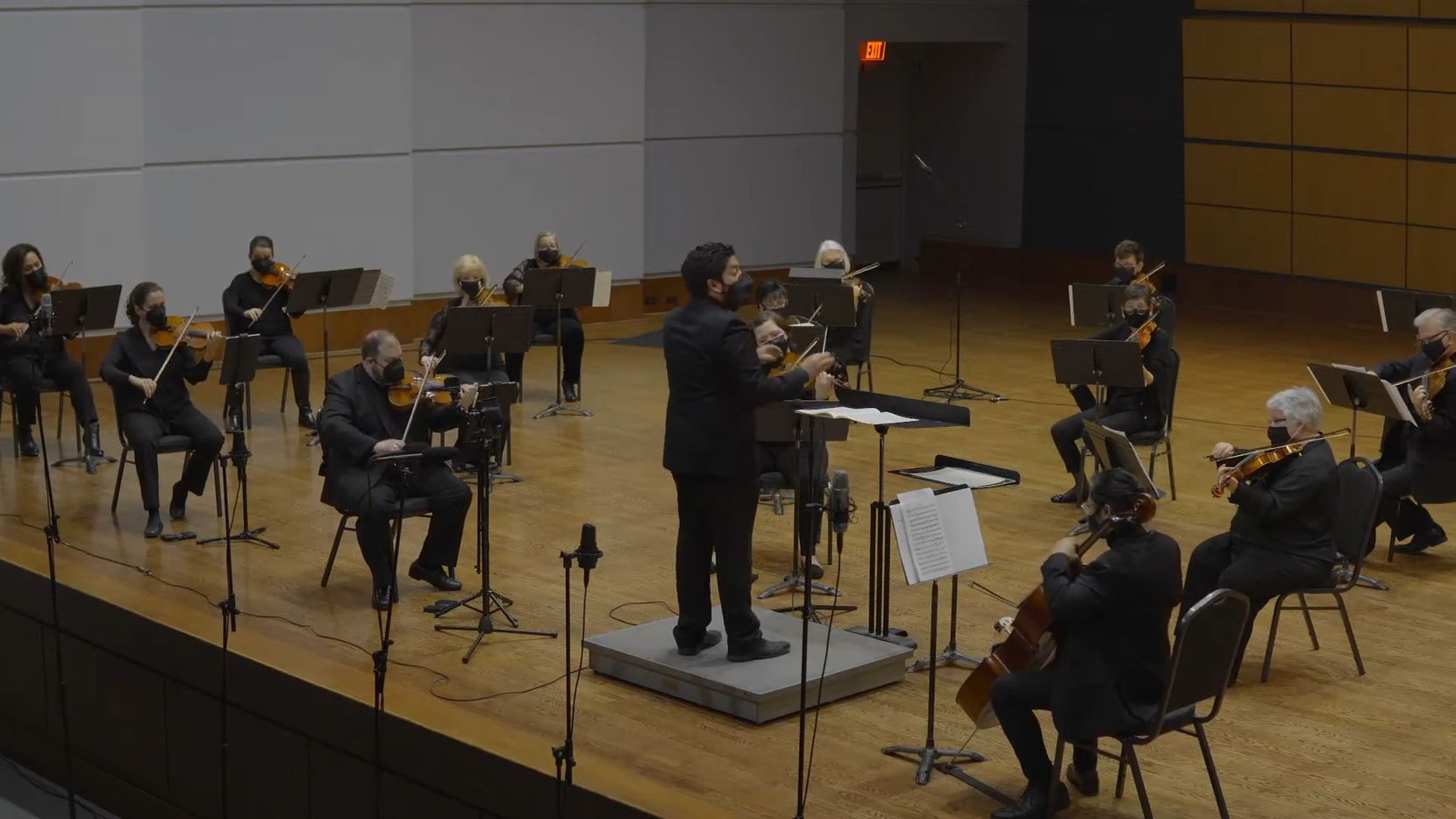 Music director Felix Torres leads string players from the Mesquite Symphony Orchestra in a...