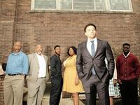 Wes Frazier (front), who stars as Minister Fletcher, is joined by the rest of the cast of...