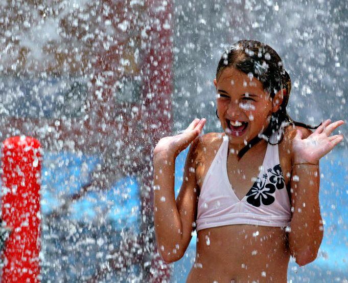 Hanna Ruehle screams while getting soaked at Bahama Beach Waterpark in Dallas.  