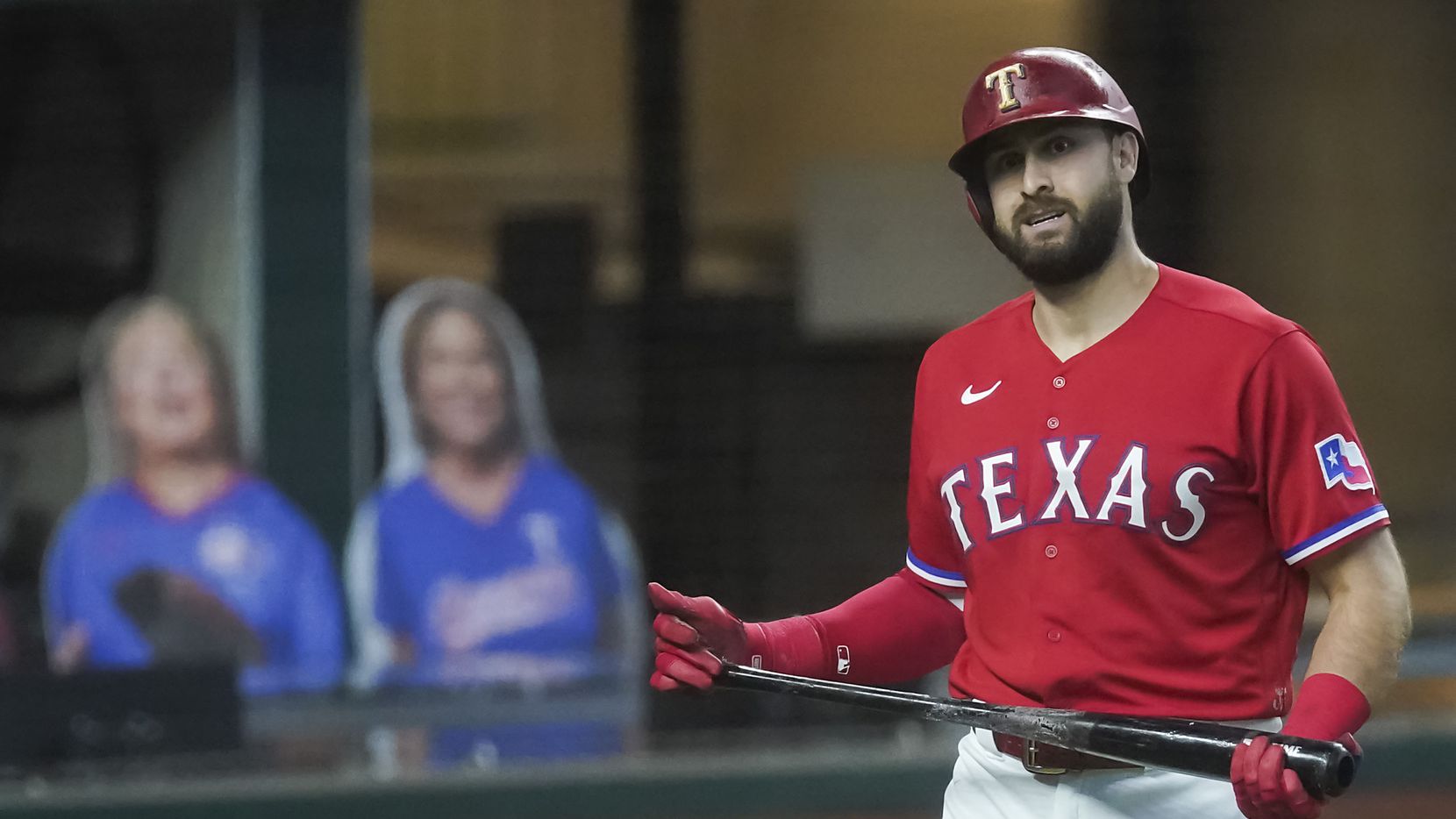 Texas Rangers outfielder Joey Gallo heads back to the dugout after a called third strike with the bases loaded during the third inning against the Los Angeles Dodgers at Globe Life Field on Sunday, Aug. 30, 2020.
