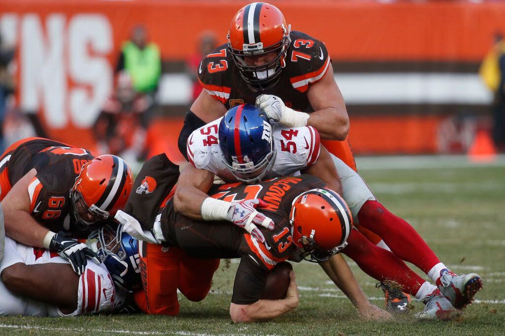 Cleveland Browns quarterback Josh McCown (13) is sacked by New York Giants defensive end...