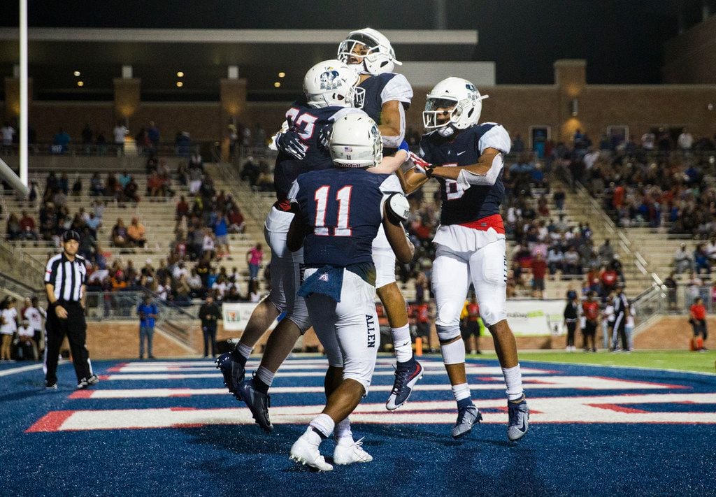 Allen running back Justin Hall (32) celebrates a touchdown with team mates during the fourth quarter of a high school football game between Allen and Cedar Hill on Friday, August 30, 2019 at Eagle Stadium in Allen. (Ashley Landis/The Dallas Morning News)
