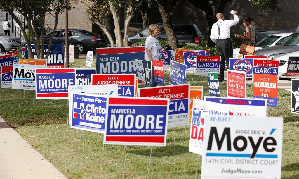 Candidates handed out fliers to voters at the Dallas County Government Center, Precinct 5,...