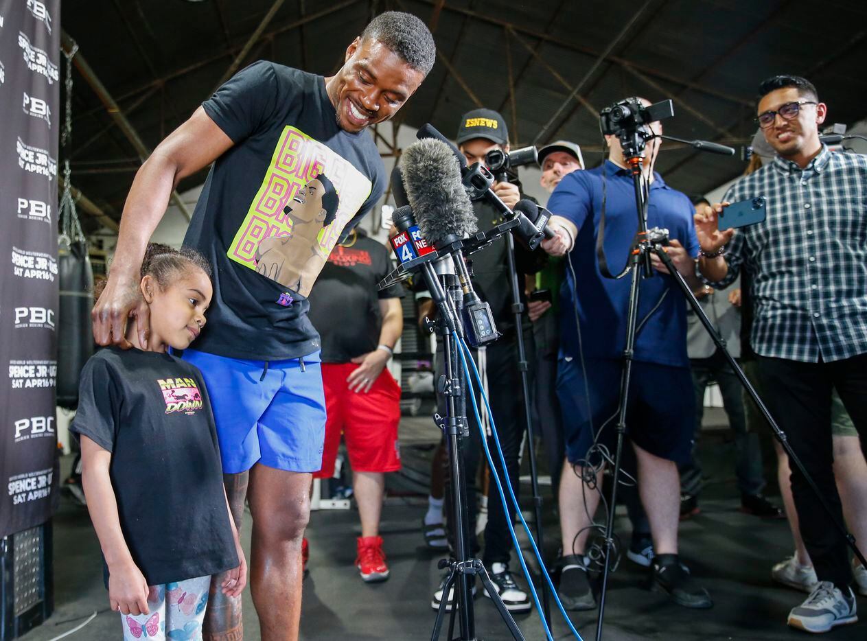 Errol Spence Jr. of Desoto, smiles towards his daughter Ivy during a press conference ahead...