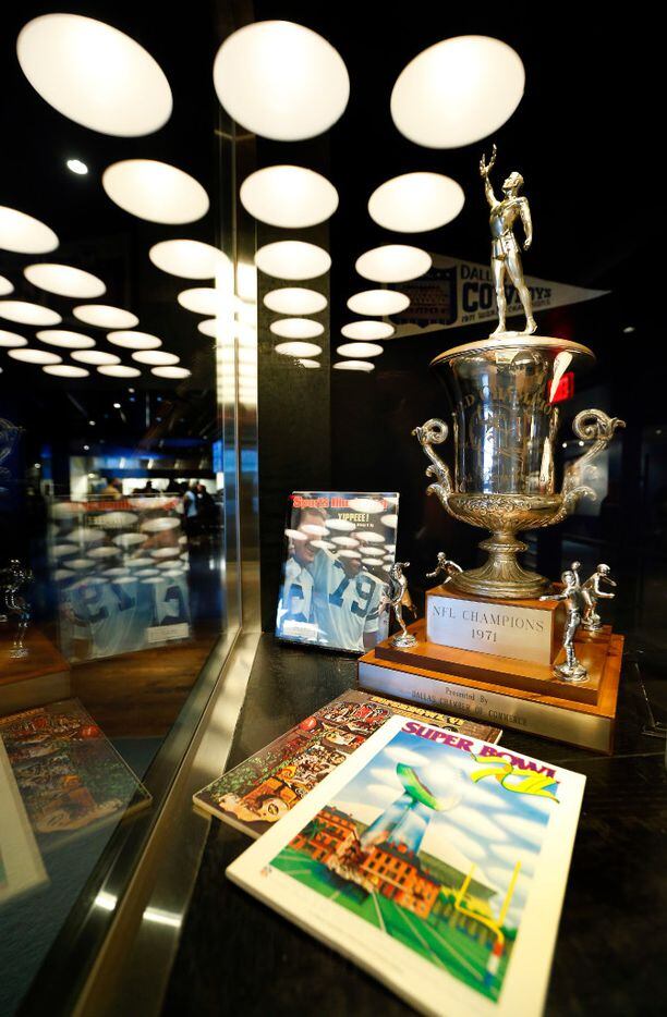 Dallas Cowboys memorabilia including a 1971 NFL Champions trophy is one display in the new...