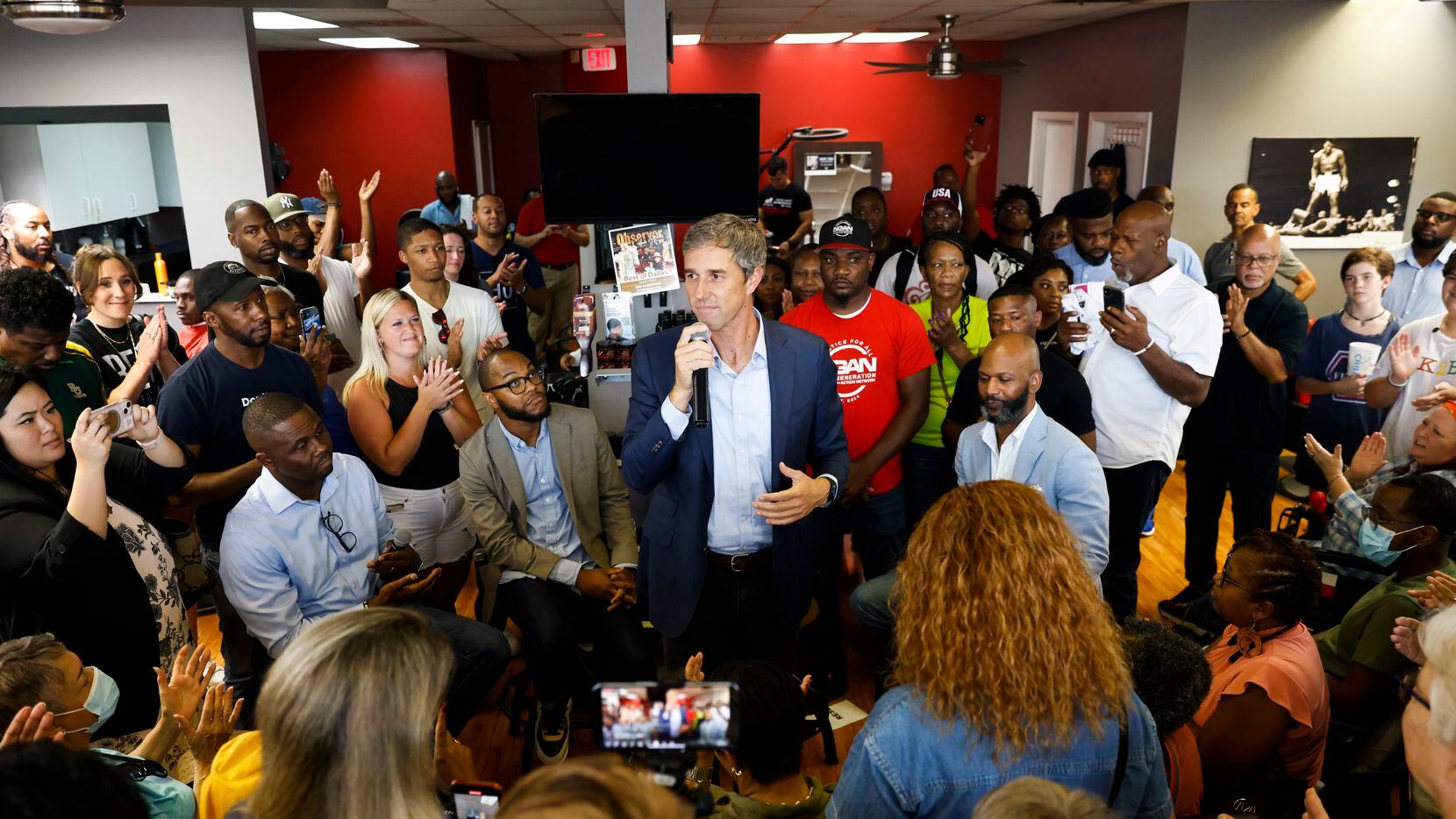 Supporters surrounds and cheers for Texas Governor candidate Beto O'Rourke as he speaks at...