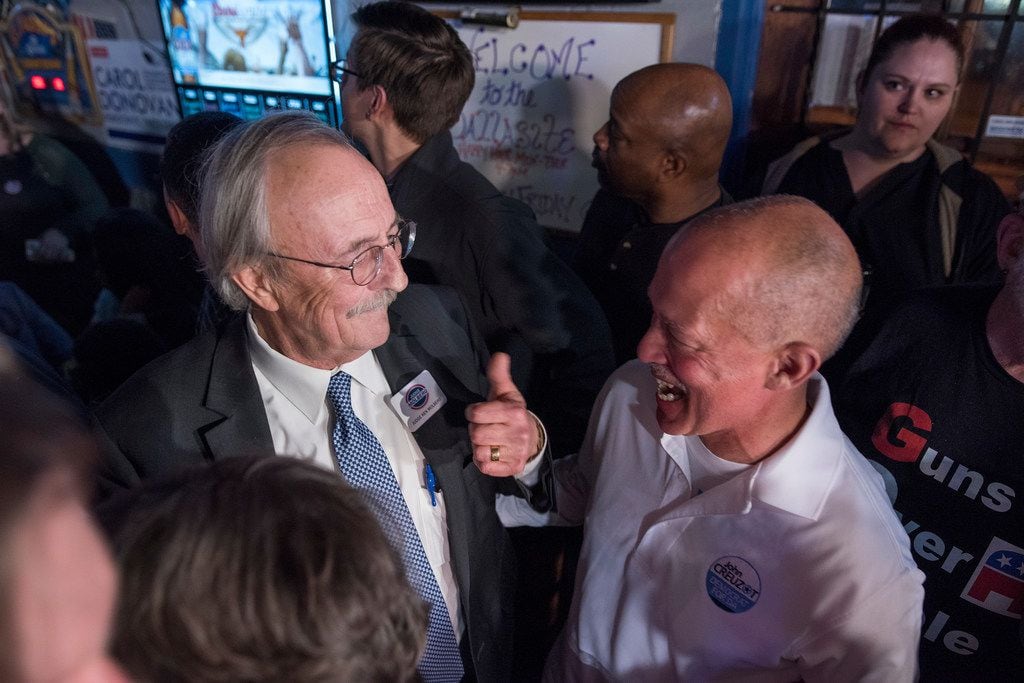 Judge Ken Molberg (left) celebrates with John Creuzot during a watching party at the...