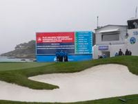 Play has been suspended due to inclement weather at the Pebble Beach Golf Links during the...