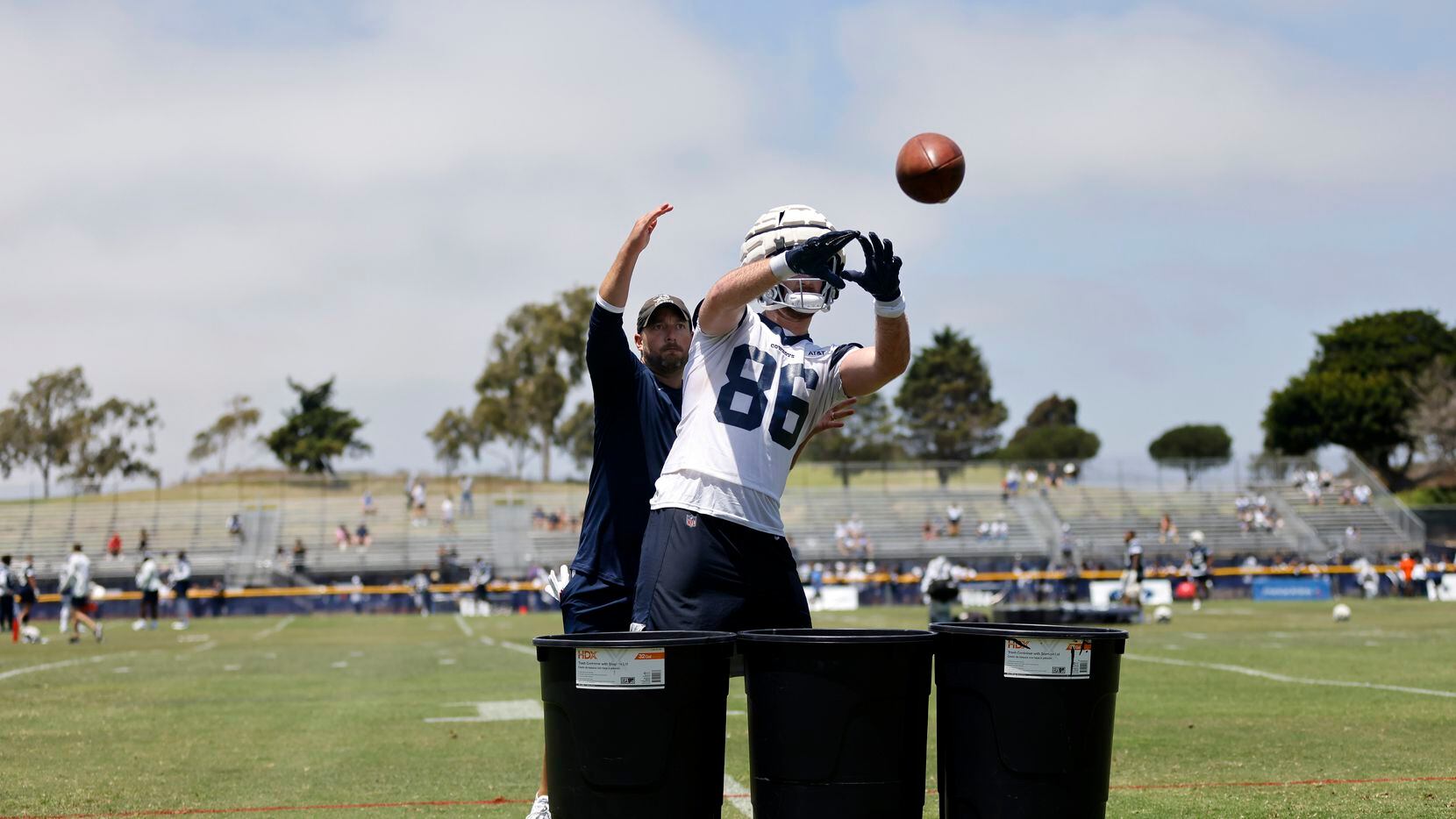 Dallas Cowboys tight end Dalton Schultz (86) works on his catching skills in front of a...