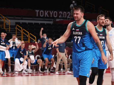 Slovenia’s Luka Doncic (77) signals a made basket after he was fouled on a basket in the...