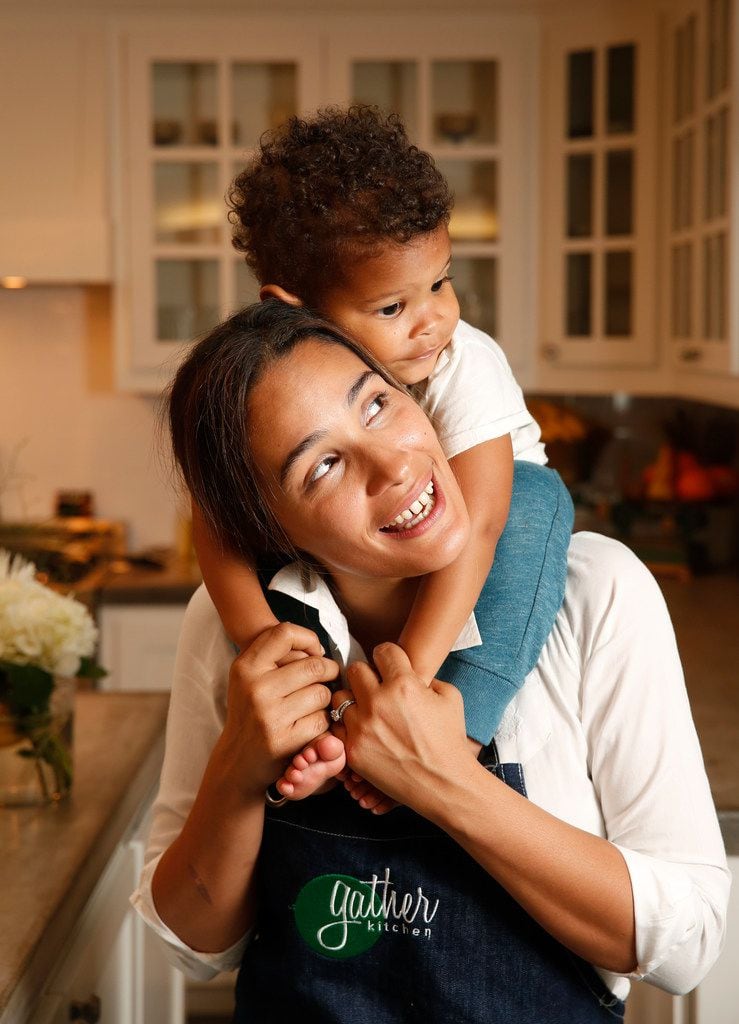 Chef Soraya Spencer, owner of Gather Kitchen, puts her 2-year-old son Ethan Zeine, who goes...