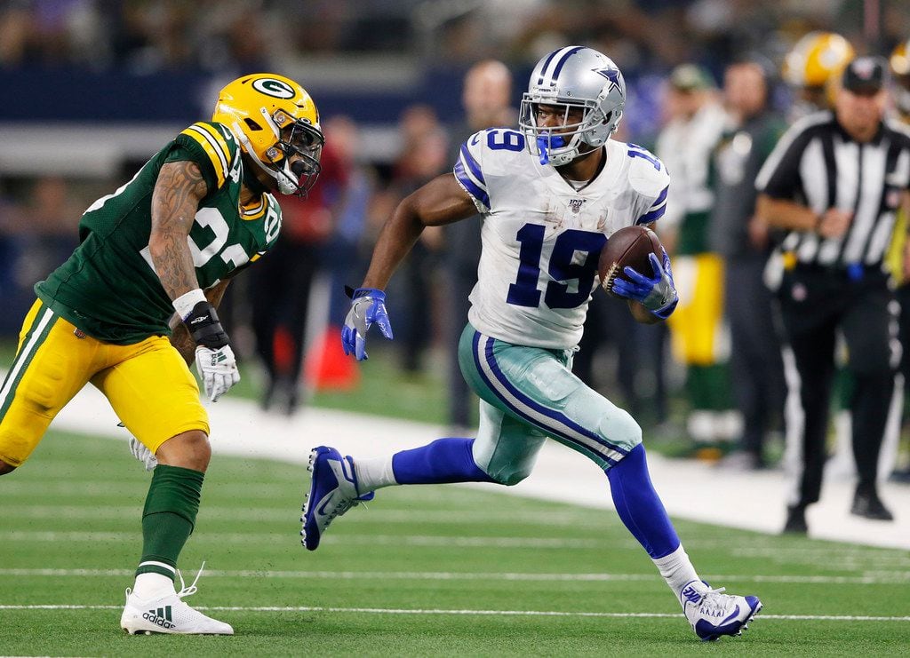 Dallas Cowboys wide receiver Amari Cooper (19) catches a pass in front of Green Bay Packers cornerback Jaire Alexander (23) on his way to the end zone for a 53 yard touchdown reception during the second half of play at AT&T Stadium in Arlington, Texas on Sunday, October 6, 2019. The Green Bay Packers defeated the Dallas Cowboys 34-24. (Vernon Bryant/The Dallas Morning News)
